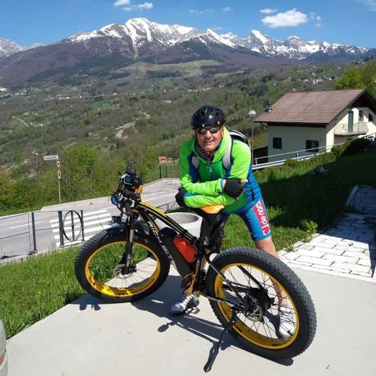 rider enjoy cycling of e-bike with brand RICHBIT on hill road